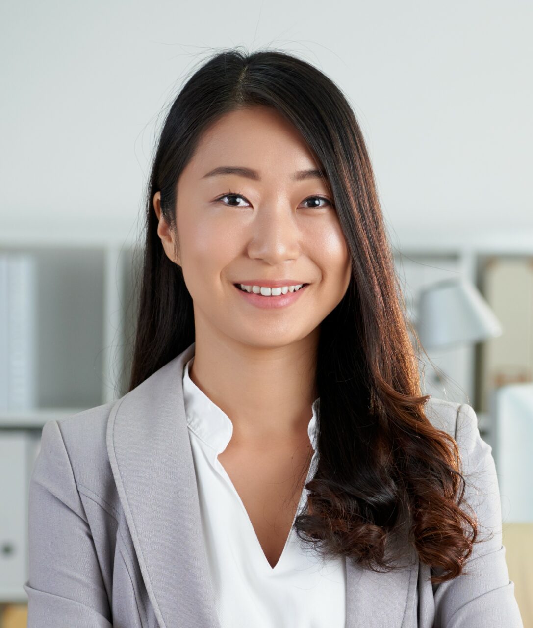 cheerful korean business lady posing office with crossed arms1